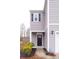 Two-story home with black front door and landscaping at 9806 Sickle Dr, Ladson, SC 29456