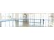 Bright indoor court with a tennis net and polished floor at 9806 Sickle Dr, Ladson, SC 29456