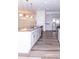 Modern kitchen with gray cabinets, granite countertops, and island at 9806 Sickle Dr, Ladson, SC 29456