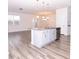 Open concept kitchen with island and granite countertops at 9806 Sickle Dr, Ladson, SC 29456