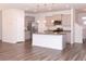 Modern kitchen with gray cabinets, granite countertops, and island at 9806 Sickle Dr, Ladson, SC 29456