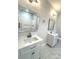 Double vanity bathroom with marble floors and large mirrors at 100 Del Ray Dr, Walterboro, SC 29488