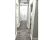 Bright hallway with hardwood floors and white doors at 100 Del Ray Dr, Walterboro, SC 29488