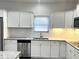 Modern kitchen with white cabinets and granite countertops at 100 Del Ray Dr, Walterboro, SC 29488