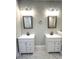 Bathroom with double vanity, marble flooring, and updated lighting fixtures at 101 Brien, Walterboro, SC 29488