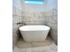Modern bathroom with freestanding tub and marble tile at 101 Brien, Walterboro, SC 29488