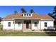 Newly constructed home with white siding, stone accents, and a brown roof at 101 Brien, Walterboro, SC 29488