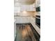 Modern kitchen with white cabinets, granite countertops and grey vinyl plank flooring at 101 Brien, Walterboro, SC 29488