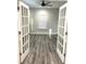 Bright office with white French doors and grey vinyl plank flooring at 101 Brien, Walterboro, SC 29488
