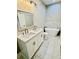Bathroom featuring a white double vanity, a large mirror, and a standalone tub at 1034 Weeks Lane, Round O, SC 29474