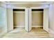 A large bedroom with light hardwood floors and two large closets with bi-fold doors at 1034 Weeks Lane, Round O, SC 29474