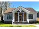Charming house with a stone facade, covered porch, and manicured lawn at 104 Del Ray Dr, Walterboro, SC 29488