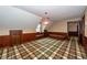 Spacious bonus room with wood paneling and plaid carpet at 108 Fairway Dr, Summerville, SC 29483