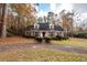 Brick house with driveway, surrounded by trees at 108 Fairway Dr, Summerville, SC 29483