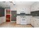 Kitchen with white cabinets, tile floor, and appliances at 108 Fairway Dr, Summerville, SC 29483
