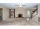 Living room with fireplace, carpet, and ceiling fan at 108 Fairway Dr, Summerville, SC 29483