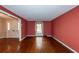 Living room with hardwood floors, red walls, and window at 108 Fairway Dr, Summerville, SC 29483