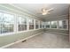 Bright sunroom with tile floor, brick wall, and multiple windows at 108 Fairway Dr, Summerville, SC 29483