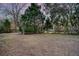 Large backyard with mature trees and plenty of space at 1111 Barrett Rd, Charleston, SC 29407