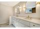 Double vanity bathroom with gold fixtures and marble floors at 1111 Barrett Rd, Charleston, SC 29407