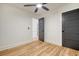 Bedroom with wood floors, ceiling fan and gray doors at 1111 Barrett Rd, Charleston, SC 29407