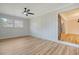 Simple bedroom with light walls, hardwood floors and ceiling fan at 1111 Barrett Rd, Charleston, SC 29407