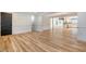 Hardwood floors, white walls and view into the kitchen at 1111 Barrett Rd, Charleston, SC 29407