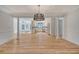 Open dining area with hardwood floors and modern chandelier at 1111 Barrett Rd, Charleston, SC 29407