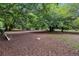 Dog park with wood chips and benches at 1111 Barrett Rd, Charleston, SC 29407