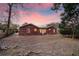 Brick house exterior with a large backyard at sunset at 1111 Barrett Rd, Charleston, SC 29407
