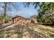 Brick house exterior with a large yard and trees at 1111 Barrett Rd, Charleston, SC 29407