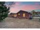 Brick house exterior at dusk, showcasing backyard at 1111 Barrett Rd, Charleston, SC 29407