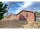 Brick house exterior with large windows and backyard at 1111 Barrett Rd, Charleston, SC 29407