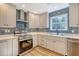Modern kitchen with stainless steel appliances and blue tile backsplash at 1111 Barrett Rd, Charleston, SC 29407
