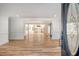 Open concept living area with hardwood floors and kitchen view at 1111 Barrett Rd, Charleston, SC 29407