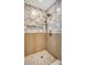Large walk-in shower with marble tile and wood feature wall at 1111 Barrett Rd, Charleston, SC 29407