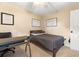 Bedroom with double bed, workspace, and wall art at 1240 Fairmont Ave # 1, Mount Pleasant, SC 29464