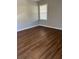 Bright bedroom with hardwood floors and large window at 206 Dora Dr, Saint George, SC 29477