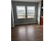 Bright dining area with hardwood floors and two large windows at 206 Dora Dr, Saint George, SC 29477