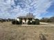 Ranch home with front porch and landscaped yard at 206 Dora Dr, Saint George, SC 29477