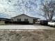 House exterior with light yellow siding and landscaping at 206 Dora Dr, Saint George, SC 29477