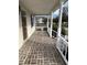 Brick paved porch with white railings at 206 Dora Dr, Saint George, SC 29477