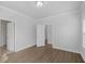 Bright bedroom with hardwood floors and access to a bathroom and hallway at 2129 Blue Bayou Blvd, Johns Island, SC 29455