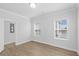 Bright bedroom with wood-look floors and two windows at 2129 Blue Bayou Blvd, Johns Island, SC 29455