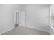 Bright bedroom with carpet, door to hallway, and window at 2129 Blue Bayou Blvd, Johns Island, SC 29455