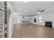 Open concept living room and kitchen with hardwood floors and a fireplace at 2129 Blue Bayou Blvd, Johns Island, SC 29455