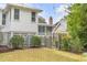 Landscaped backyard with storage shed and gate at 222 Haddrell St, Mount Pleasant, SC 29464