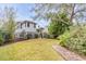Spacious backyard with brick pathway and lush landscaping at 222 Haddrell St, Mount Pleasant, SC 29464