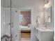 Clean bathroom with a modern vanity and a view into bedroom at 222 Haddrell St, Mount Pleasant, SC 29464