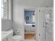 Simple bathroom with white tile, toilet and a view of bedroom at 222 Haddrell St, Mount Pleasant, SC 29464